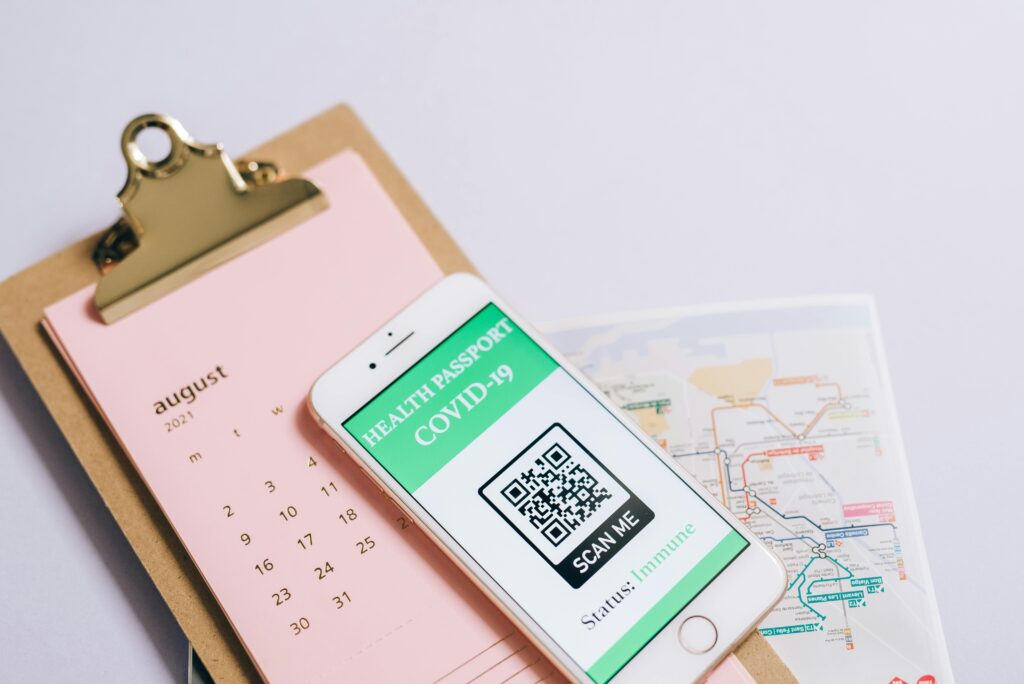 Smartphone with health passport and calendar for organized travel planning.